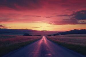 Road to Cross Silhouette at Sunset with Dramatic Sky and Meadow photo