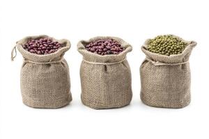 Three Burlap Sacks Filled with Different Beans on a White Background photo