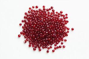 Pile of Round Red Gel Beads on White Background Simple Still Life photo