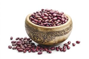 Red Kidney Beans in Wooden Bowl Spilling on White Surface photo
