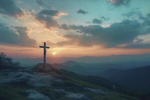 Christian Cross on Mountain Peak at Sunset with Scenic Landscape photo