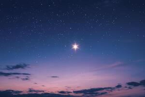 Bright Star Shining in Dark Blue Night Sky at Twilight Hour photo