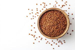 Serving Sorghum Grains in a Wooden Bowl on a White Background photo