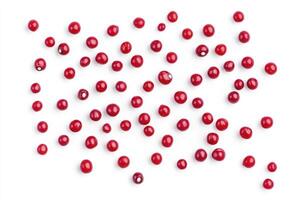 Scattered Red Cranberries on White Background for Food and Holiday Themes photo