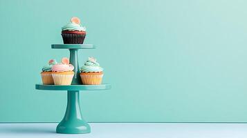 Three tiered cake stands with cupcakes on them photo