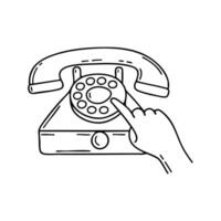 A hand dialing a number on an old rotary phone vector