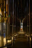 Large stainless steel tanks stand in a winery, ready for the wine fermentation process. photo