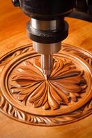 CNC Router Carving Intricate Floral Pattern in Wood Craftsmanship, Precision, Automation photo