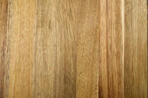 This high-resolution image showcases a rich wood grain texture in warm light brown. It features natural patterns, knots, and striations, perfect for various design applications. photo