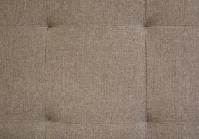 This elegant retro tufted brown fabric background features unique button accents that enhance its vintage charm. Ideal for interior design and upholstery, it adds warmth and comfort to any space. photo
