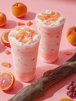 Two cups of a drink with ice and an orange slice in the middle photo