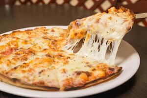 A slice of pizza with cheese on it photo