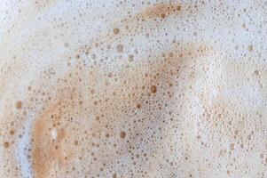 A foam of bubbles is on a white background photo
