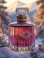 A bottle of perfume is displayed in a snowy forest setting photo