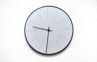 A clock with the hands on the number 3 and 9 photo