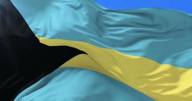 Bahamian flag waving at wind in slow with blue sky, loop video
