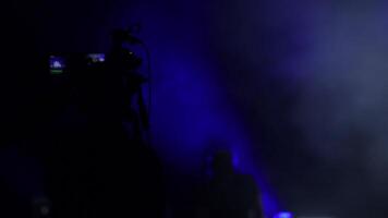 Camera operator working in a rock concert video