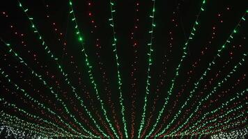 Holiday illumination at the top Green and red lights background on black video