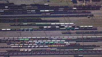 Aerial view of Railway sorting station and A lot of wagons at a railway. Drone flies over railway tracks. 4k quality video
