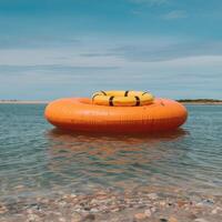 An inflatable raft floating in the ocean photo