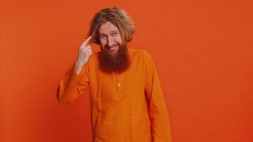 Confused Caucasian man pointing at camera showing stupid asking for insane crazy bad plan, bullying video