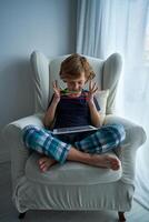 Content boy watching while playing string game photo
