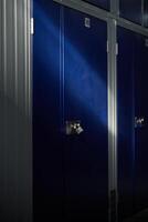 Modern blue lockers in rows in container building photo