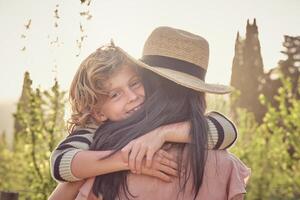 Happy son with mother on sunny day photo
