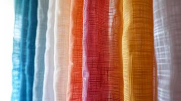 Close-up of vibrant, colorful curtain fabrics hanging in a row, highlighting their texture and patterns. photo
