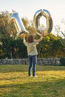 Anonymous boy with number ten made out of balloons photo