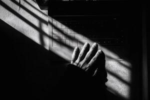 Daytime hand on keyboard with shadows, AI image photo