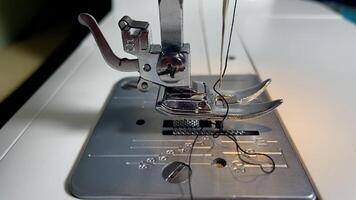 Sewing machine at work creating delicate fabric patterns photo