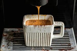 Espresso brewing in a rustic coffee cup. photo