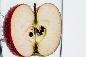 Sliced apple in fizzy water creates a refreshing display. photo