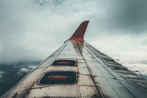 Captivating view from an airplane wing high above clouds. photo