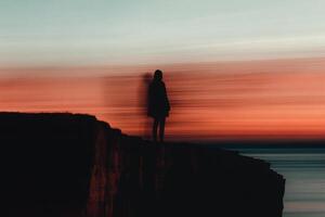 Embracing the twilight at the cliff's edge. photo
