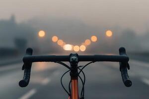 Riding into a misty dawn on a quiet empty road. photo