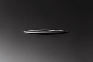 Floating record on a dark background showcases musical art. photo
