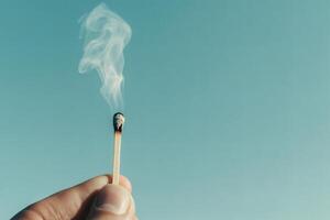 Flickering flame and drifting smoke create a moment. photo