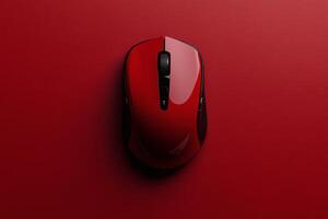 Sleek red computer mouse on vibrant red background. photo