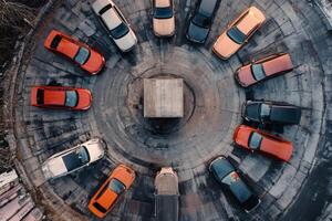 Cars in a circle around a central platform. photo