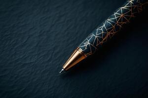 Elegant pen resting on a textured surface in darkness. photo