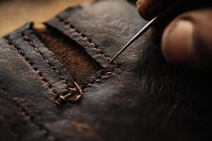 Crafting a Leather Wallet With Precision Stitching in a Workshop Setting. photo