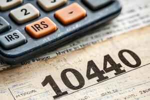 Calculating taxes with a vintage calculator photo