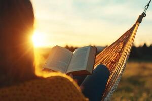 Reading at sunset in a cozy hammock photo