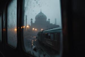 Glimpse of a majestic mausoleum through rain-splattered train windows in the early evening twilight photo