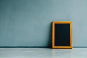Minimalist wooden frame against a textured blue wall capturing the essence of simplicity and space in modern design photo