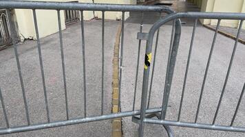 Barrier blocking pathway near historic building in city photo