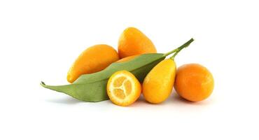 Fresh kumquats with leaves and a half kumquat showing the pulp photo
