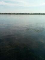 A quiet river on a clear summer day photo